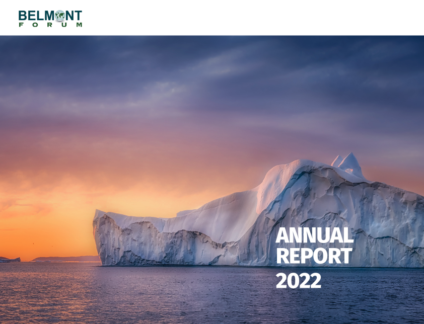 Cover of the Belmont Forum Annual Report 2022. A large iceberg floats in calm ocean waters under a dramatic sunset sky with purple and orange hues. The Belmont Forum logo appears in the top left corner, and the text "Annual Report 2022" is in bold white letters at the bottom right.